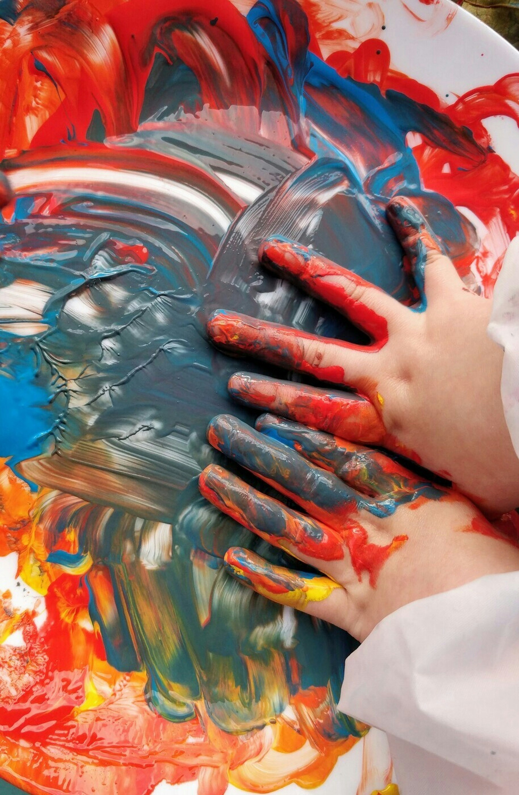 Children painting together during a SparkPreneurs class